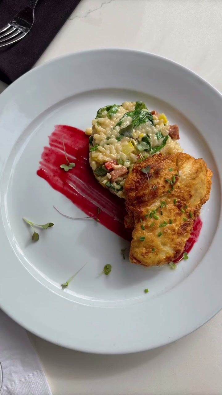 Pan Fried Chicken with andouille risotto and blackberry gastrique